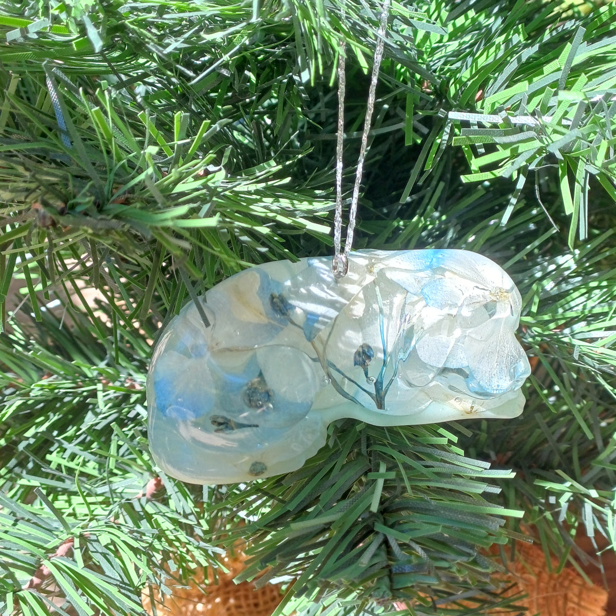 Christmas ornament - handmade resin pet figurine with real pressed flowers, angled view